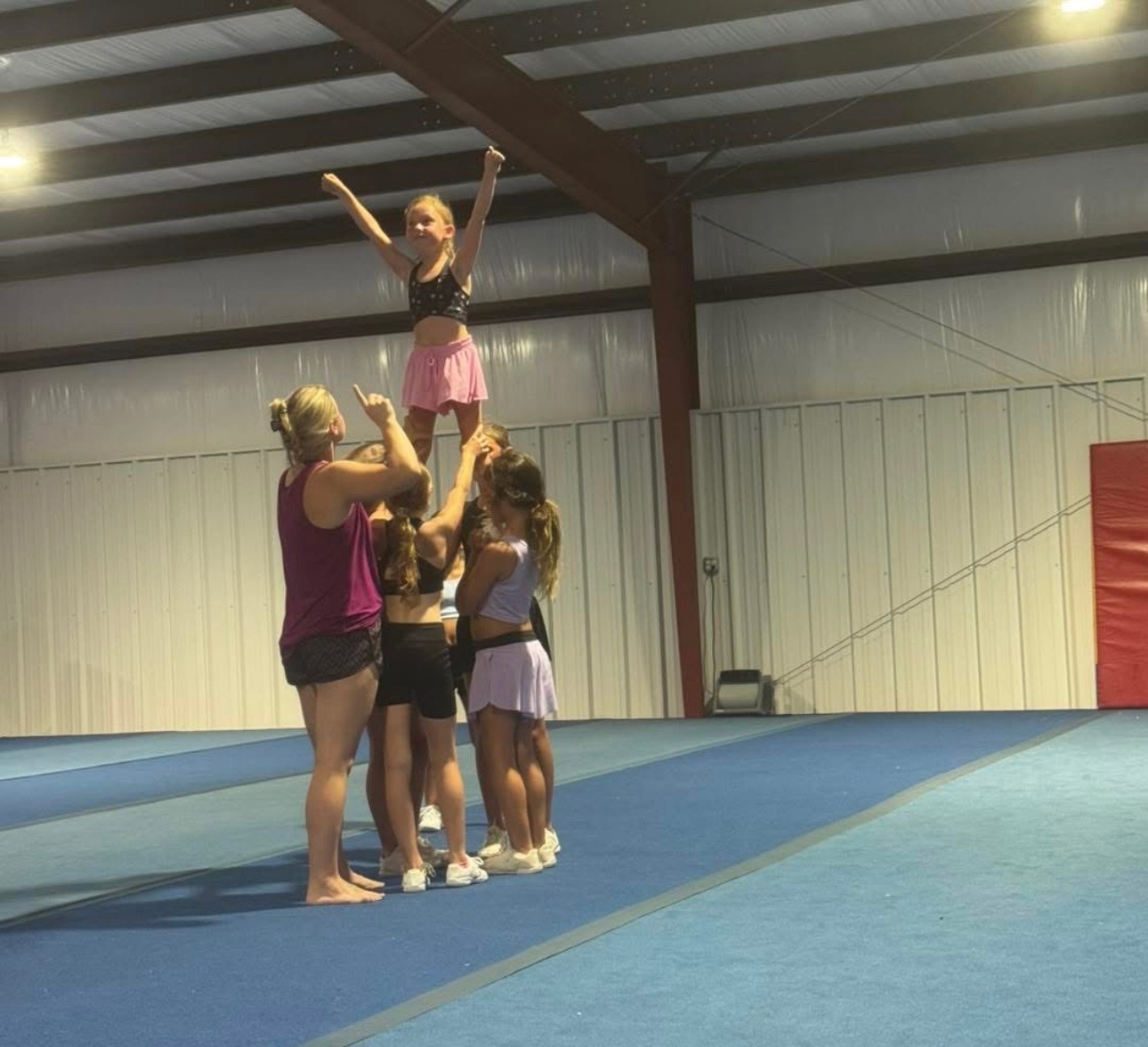 Cheer stunt group practicing
